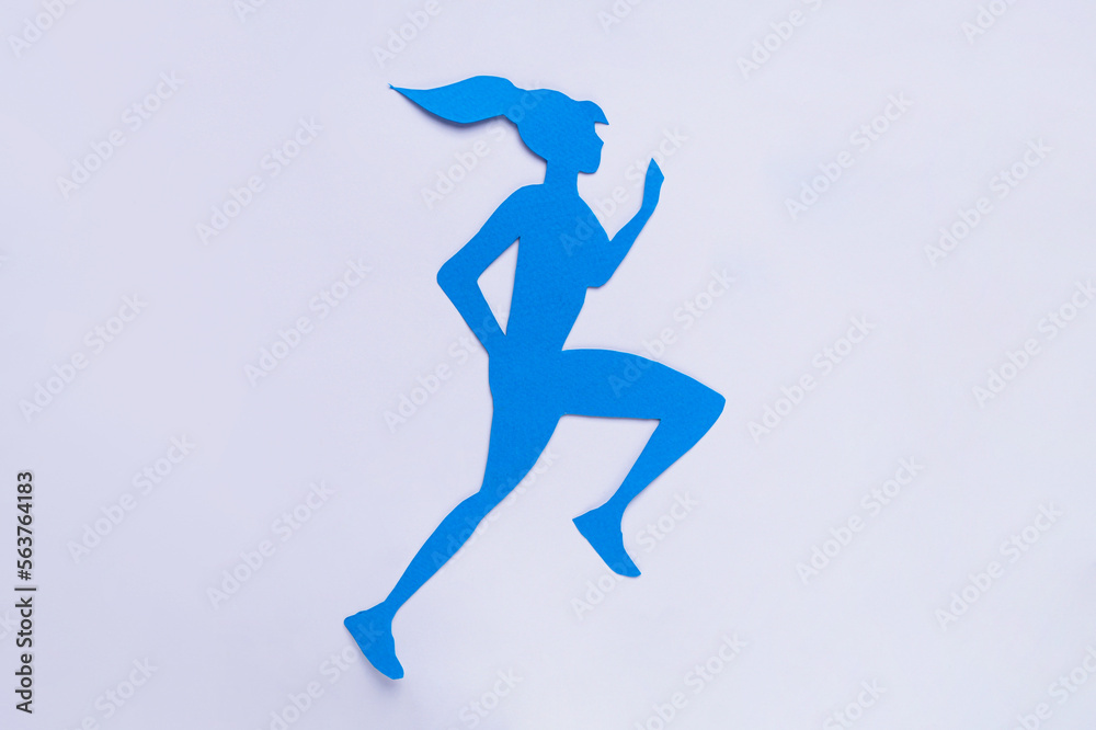 Woman`s health. Paper female figure running on white background, top view
