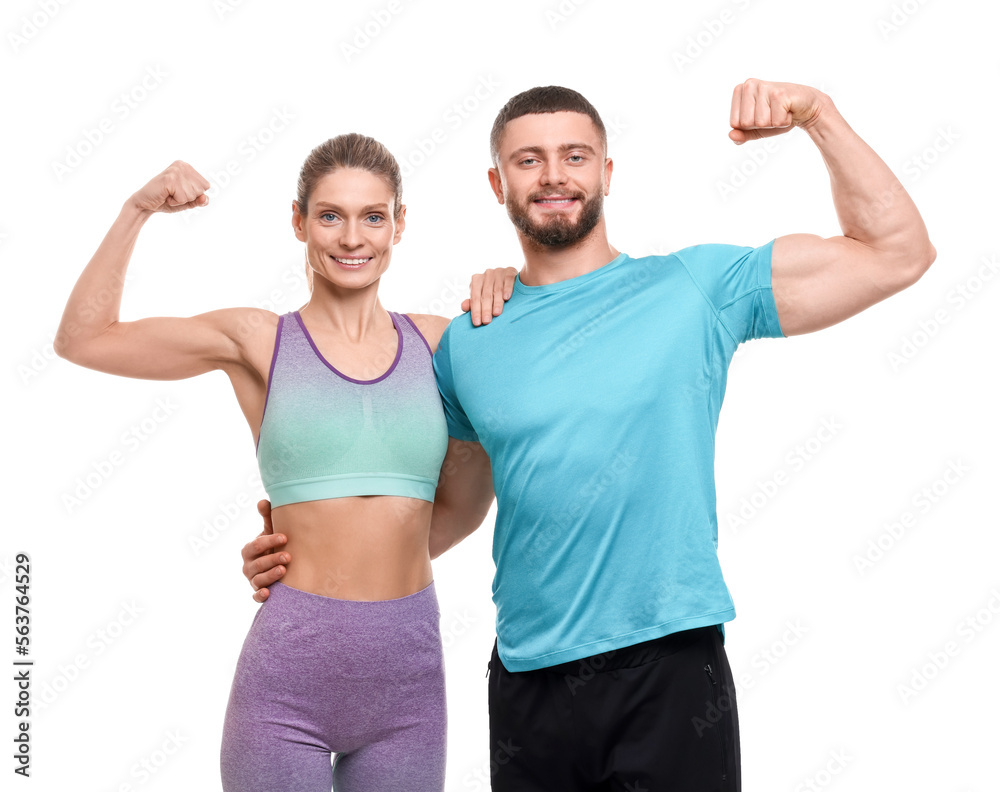 Athletic people showing muscles on white background Athletic people showing muscles on white background