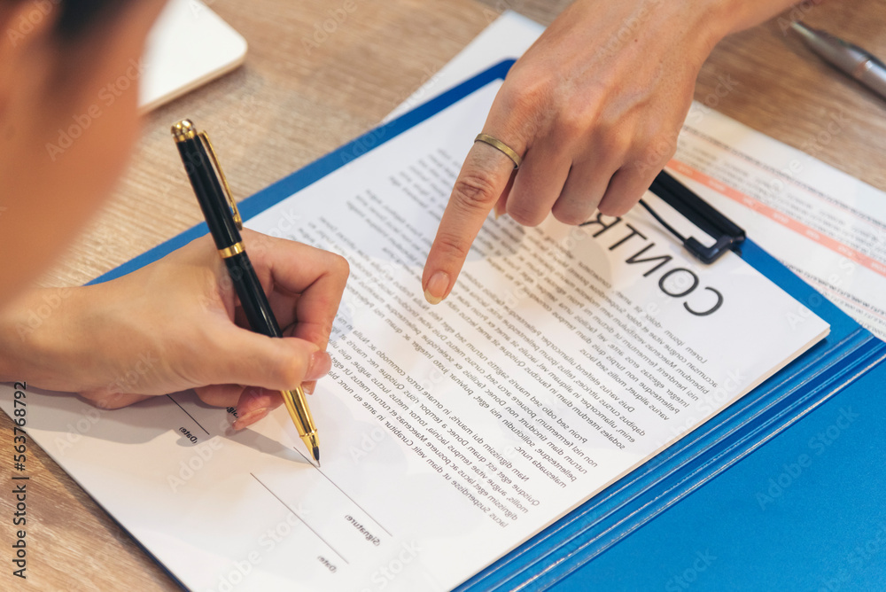 Close up Team Businesswoman hands partners sign contract with success business deal. Diversity Businesswoman teams handshake together. Partnership teamwork meeting signing contract business concept Close up Team Businesswoman hands partners sign contract with success business deal. Diversity Businesswoman teams handshake together. Partnership teamwork meeting signing contract business concept