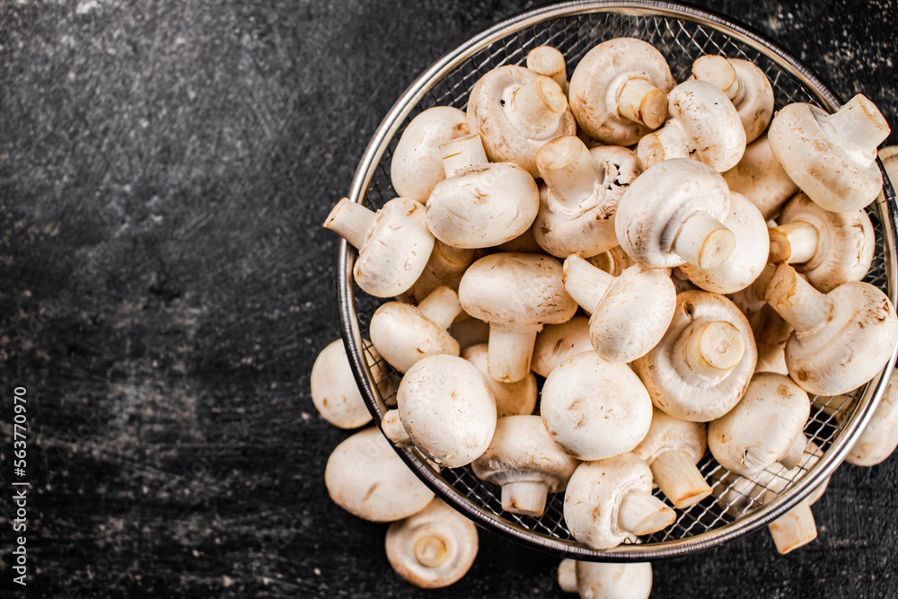 Fresh mushrooms in a colander. Fresh mushrooms in a colander.