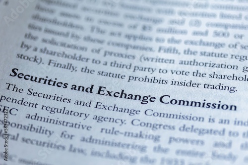 legal or law book with SEC or securities and exchange commission focused in closeup of explanation 