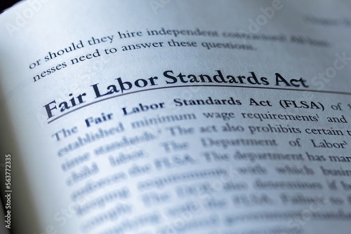 legal or law book with fair labor standards act or FLSA focused in closeup of explanation 