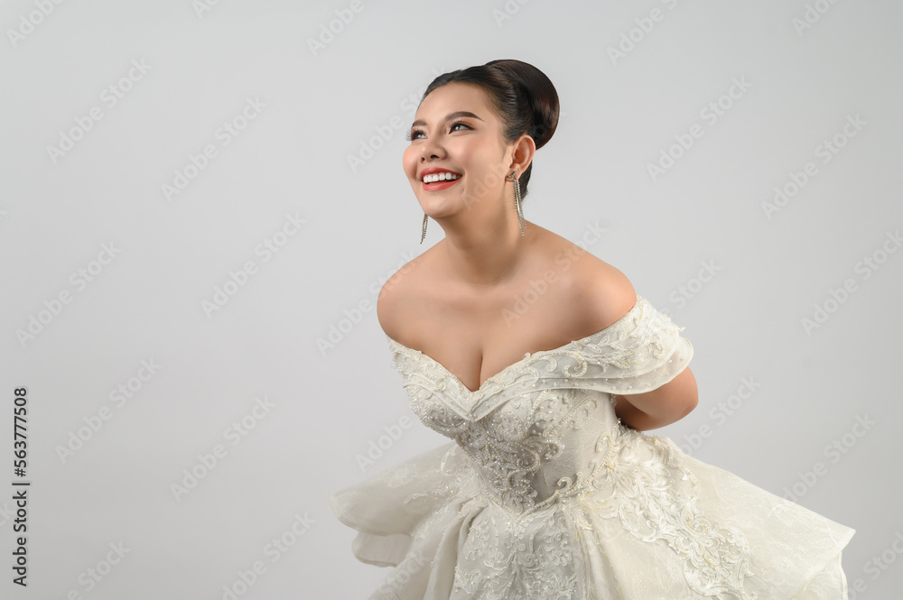 Young asian beautiful bride smiling with happy on white background Young asian beautiful bride smiling with happy on white background