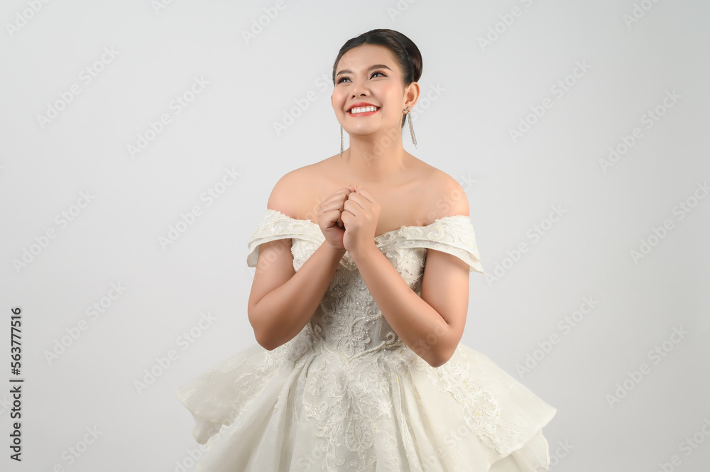 Young asian beautiful bride smiling with happy on white background Young asian beautiful bride smiling with happy on white background