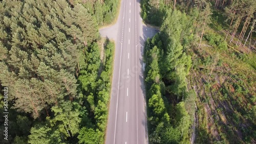 The highway passes through the Ukrainian forest. High quality FullHD footage