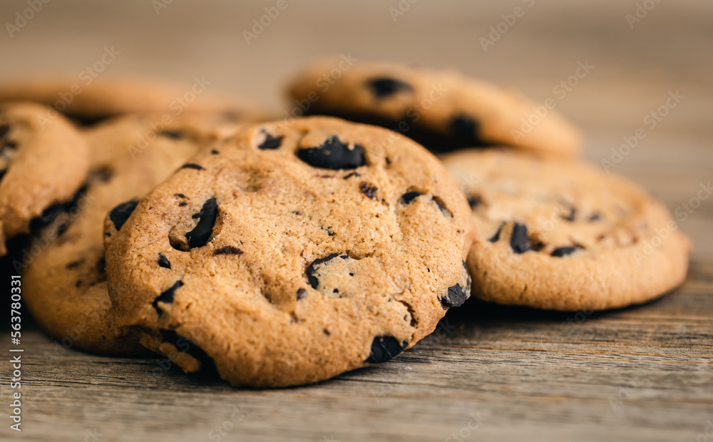 Cookies with chocolate crisps on a rustic wooden background, close-up. Cookies with chocolate crisps on a rustic wooden background, close-up.