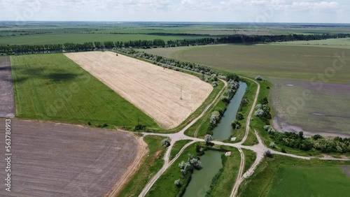 Turning the irrigation canal with the bridge among the fields. High quality FullHD footage