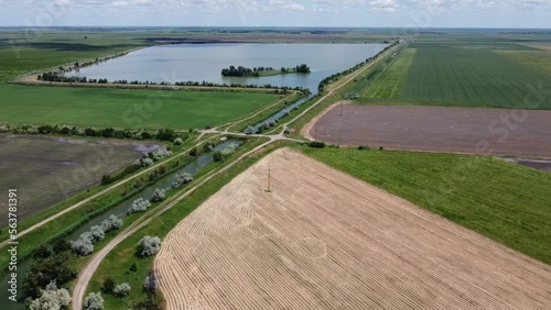 The bridge over the river that flows into the lake with the island. Aerial. High quality FullHD footage