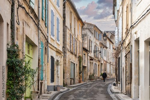 A man walk in a medieval street of Arles city in France