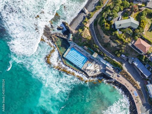 Beautiful high angle bird's eye aerial drone view of a hot salt water pool and the ocean in St Clair, a beachside suburb of Dunedin, the second-largest city in the South Island of New Zealand.