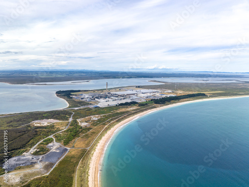Murais de parede High angle aerial drone view of Tiwai Point peninsula at the entrance to Bluff Harbour on the southern coast of the South Island of New Zealand