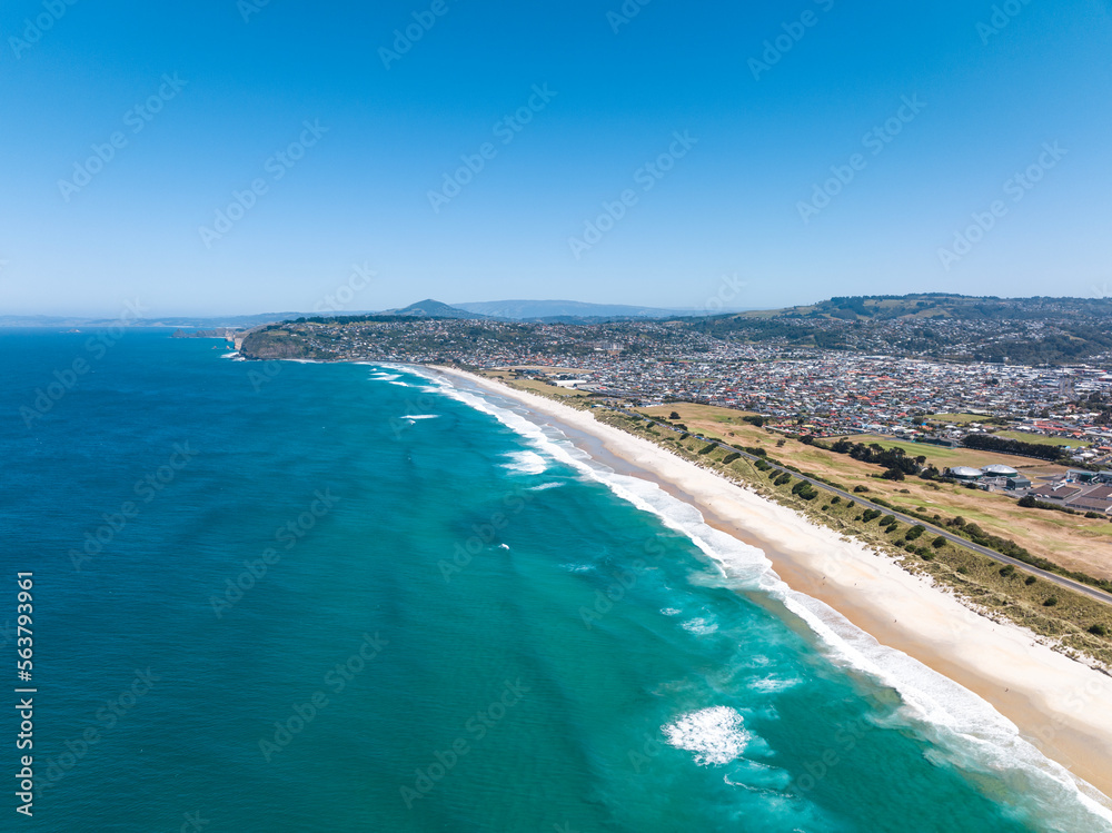 High angle aerial drone view of Lawyers Head Beach, Saint Kilda Beach and Saint Clair Beach (one continuous beach) in Dunedin, the second-largest city in the South Island of New Zealand.
