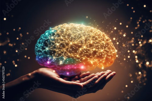Hand holding glowing brain