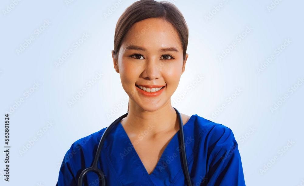 Portrait thai female surgeon in blue uniform with gentle medical stethoscope standing relaxed smiling at camera friendly to everyone, light blue background : Clipping Path Portrait thai female surgeon in blue uniform with gentle medical stethoscope standing relaxed smiling at camera friendly to everyone, light blue background : Clipping Path