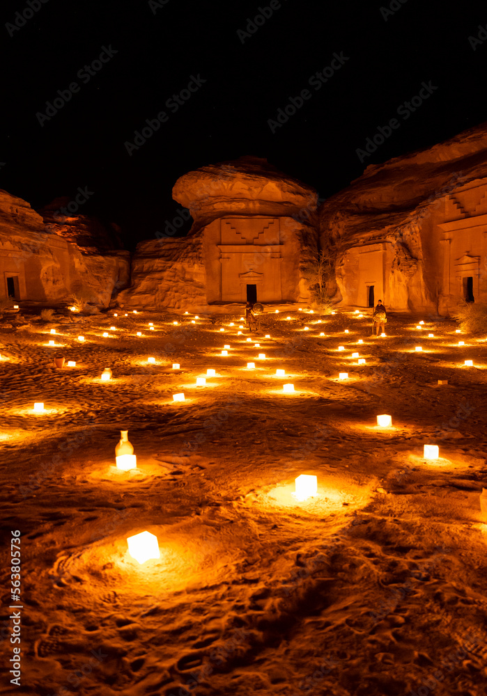 Tombs at the Mada'in Saleh (Hegra) archeological site lit up after dark, north west Saudi Arabia
