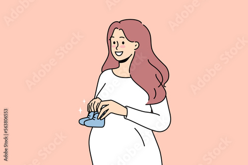 Smiling young pregnant woman holding baby shoes in hands excited about motherhood. Happy future mother awaiting parenthood. Pregnancy. Vector illustration. 
