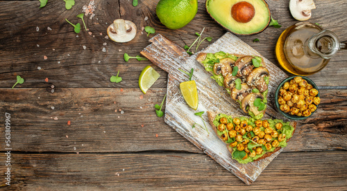 vegetarian sandwiches with avocado guacamole, chickpeas and mushrooms, Long banner format. top view