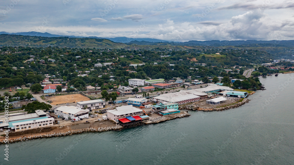 Reclaimed land with hospitality and hotel infrastructure near the shoreline in Honiara.