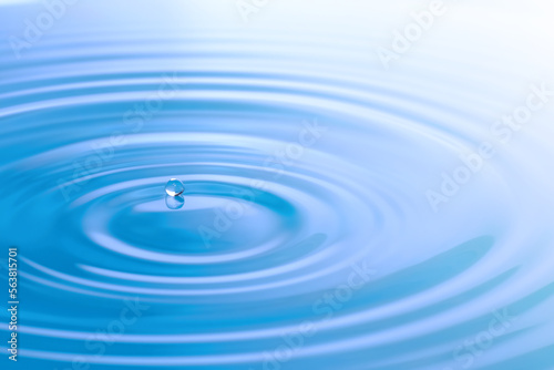 Waves of water are caused by falling droplets. 3d illustration. close-up view.