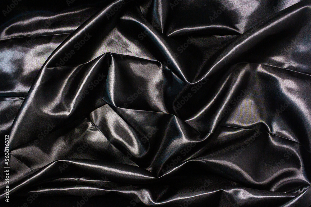 Abstract background, black wavy cloth texture. Abstract background, black wavy cloth texture.
