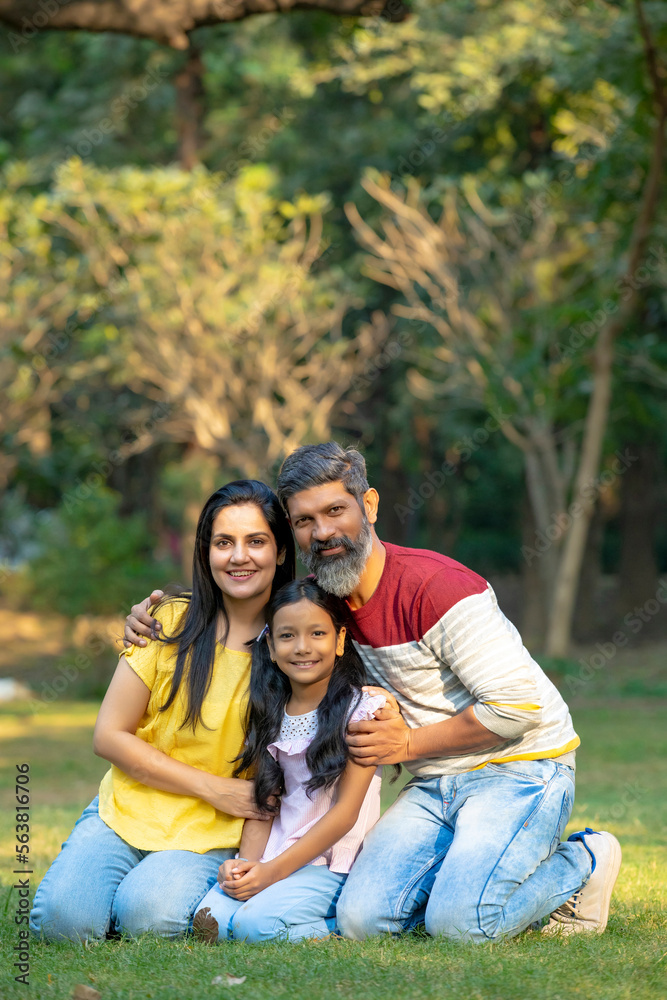 Happy indian couple with his little daughter at park. Happy indian couple with his little daughter at park.