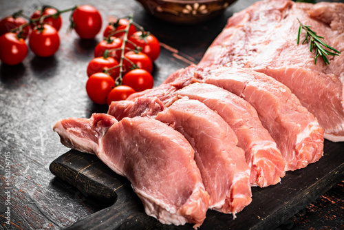 Sliced pork raw on a cutting board. 
