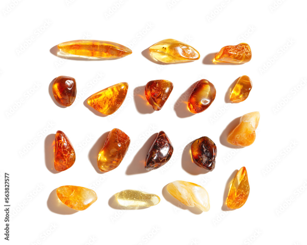 Set of Natural gemstone amber stones at sunlight, yellow orange gradient color isolated on white background. Natural mineral. Aesthetic Amber gems flatlay pattern, pieces ancient resin Set of Natural gemstone amber stones at sunlight, yellow orange gradient color isolated on white background. Natural mineral. Aesthetic Amber gems flatlay pattern, pieces ancient resin