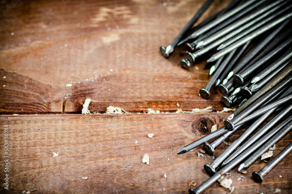 A bunch of nails on the table. A bunch of nails on the table.