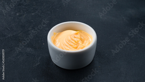 Mayonnaise sauce in a small ceramic bowl.