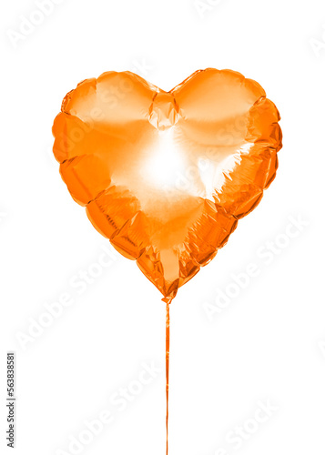 an inflatable ball in the shape of a heart in orange color isolated on a white background. Decoration for holiday, birthday. High quality photo