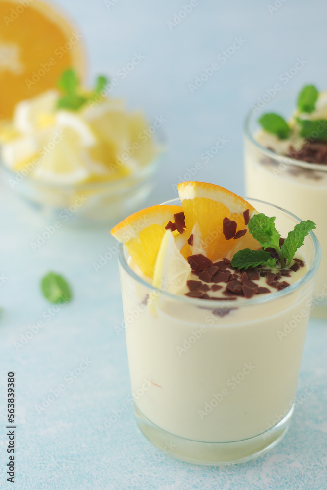Orange lemon citrus milk mousse in glasses Orange lemon citrus milk mousse in glasses
