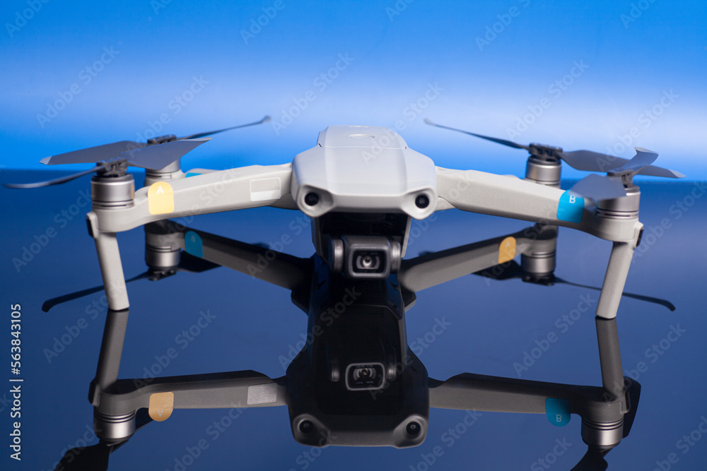 quadcopter drone aerial camera on blue background. quadcopter drone aerial camera on blue background.