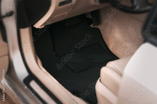 Luxury car with white leather interior with high-quality EVA floor mats in black color Fototapet