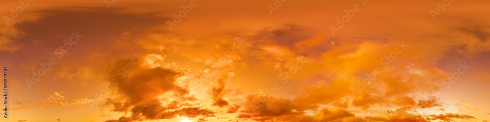 Golden glowing red orange overcast sunset sky panorama. Hdr seamless spherical equirectangular 360 panorama. Sky dome or zenith for 3D visualization and sky replacement for aerial drone 360 panoramas.