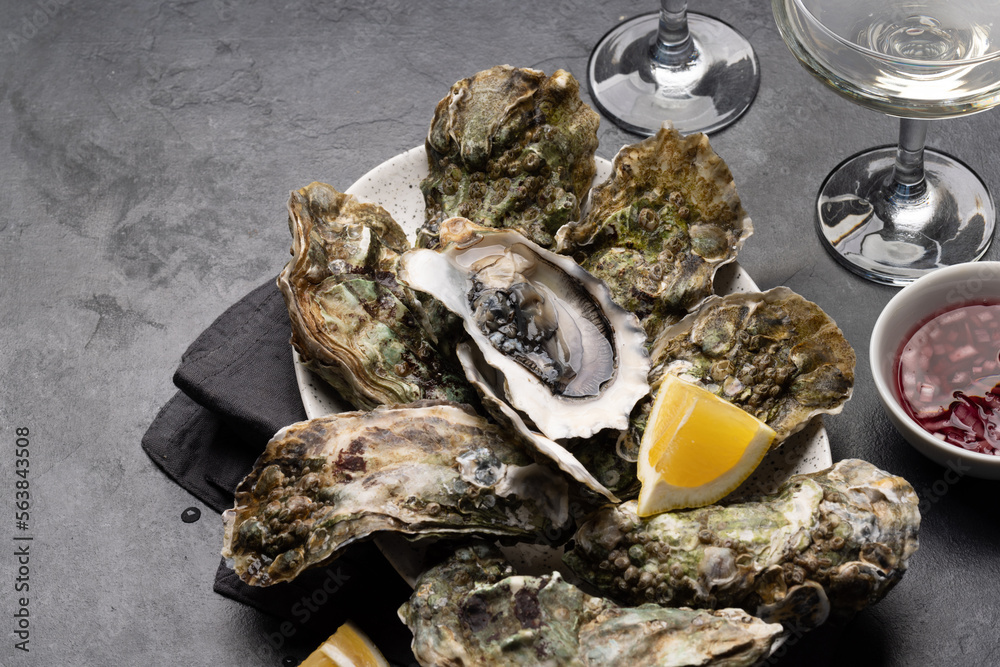 Fresh oysters with glasses of sparkling wine Fresh oysters with glasses of sparkling wine