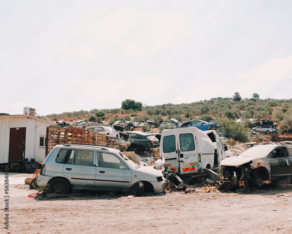 Pile of discarded old cars on junkyard. Environmental problem concept