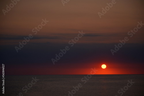 A beautiful sunset on the seashore. © gojalia