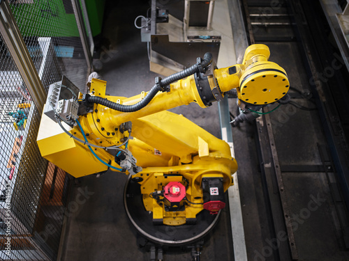 Robotic arm in modern factory photo