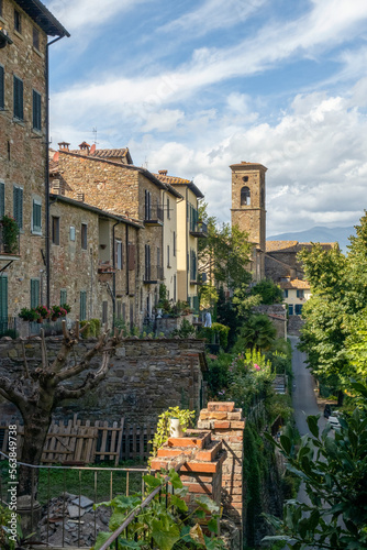 Italy, Tuscany, Poppi, Town houses in summer with tower of Chiesa di San Fedele church in background photo