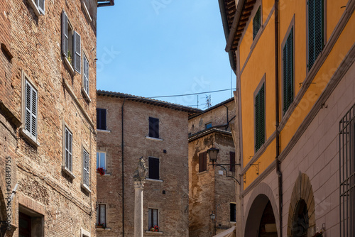 Italy, Tuscany, Montepulciano, Old town houses surrounding Colonna del Marzocco photo