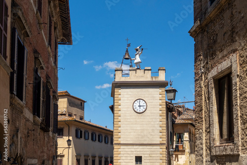 Italy, Tuscany, Montepulciano, Historic Torre di Pulcinella clock tower photo
