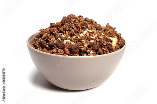 granola with oatmeal with nuts and fruits in a bowl on a white background