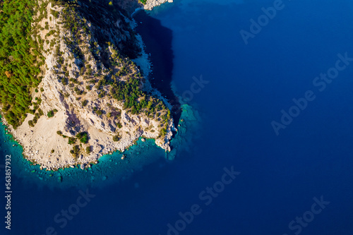 A picture from a drone top view of a amazing rock in the azure Mediterranean Sea. Beautiful travel background.