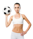 Sporty woman holding a soccer ball