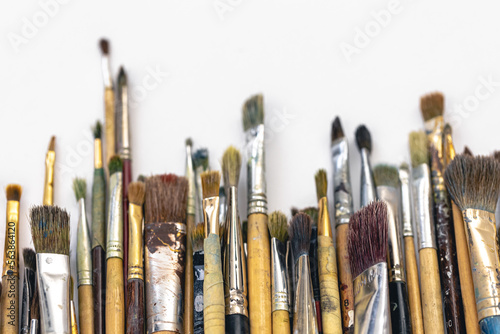 Paint brushes of different sizes on a white background isolated.