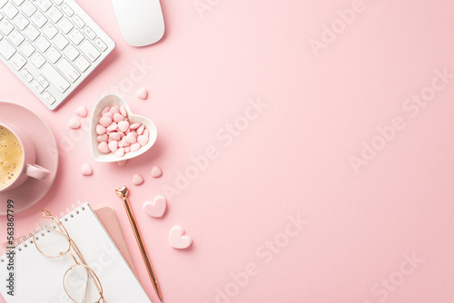 Valentine's Day concept. Top view photo of notepad pen keyboard computer mouse glasses heart shaped plate with sprinkles and cup of coffee on saucer on isolated pastel pink background with empty space