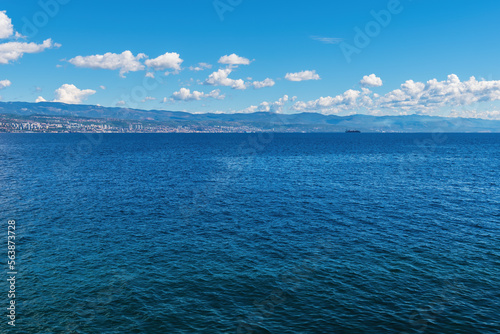 Town of Rijeka on Croatian Adriatic sea coastline seen from the Kvarner gulf shoreline and town of Lovran photo