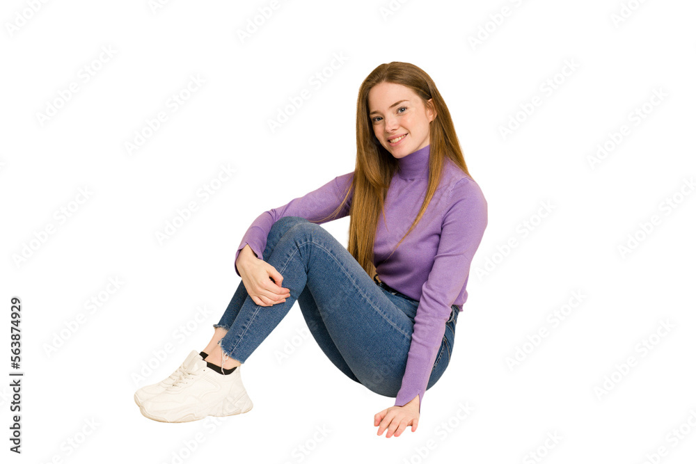 Young redhead woman sitting isolated cut out Young redhead woman sitting isolated cut out