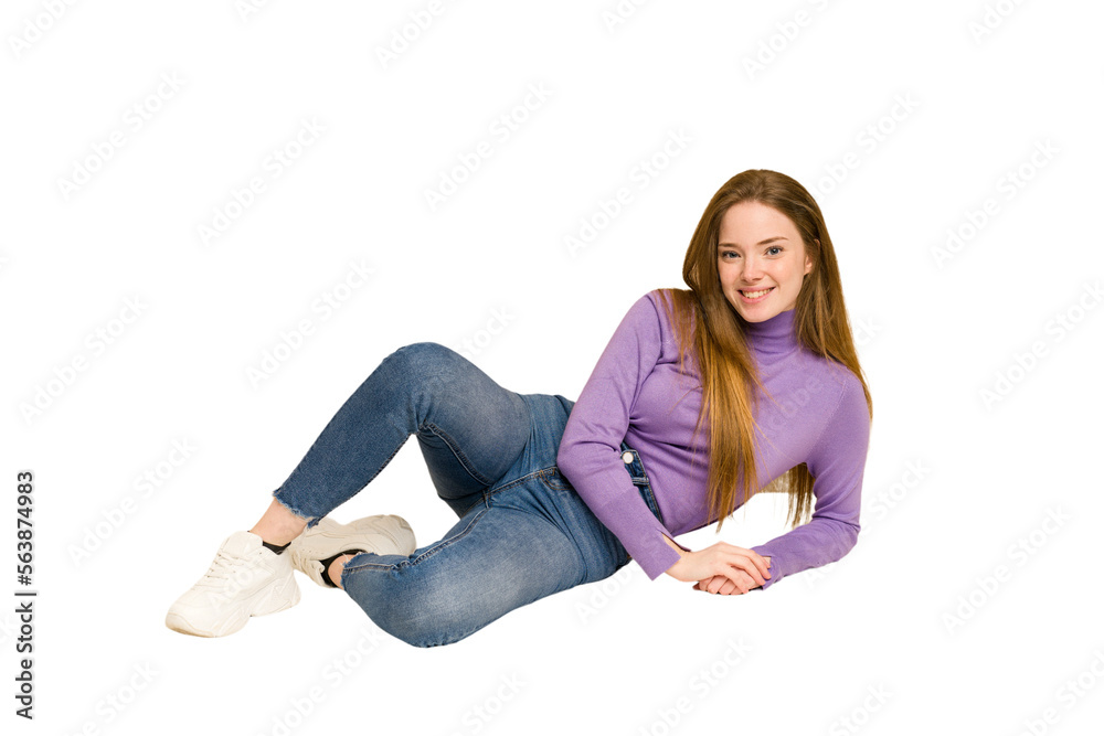 Young redhead woman sitting isolated cut out Young redhead woman sitting isolated cut out