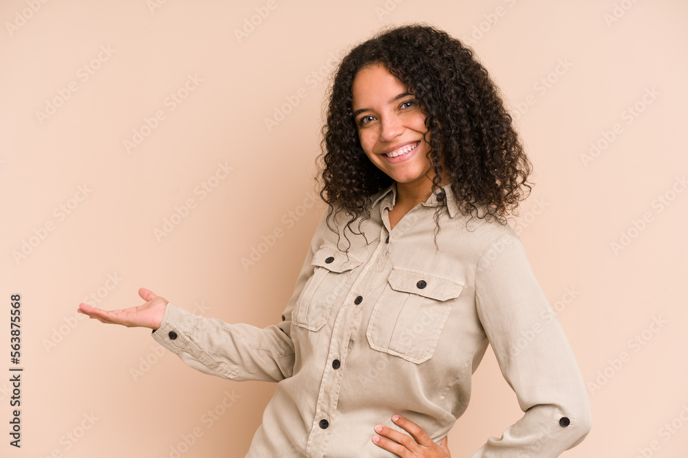 Young african american curly woman isolated showing a welcome expression. Young african american curly woman isolated showing a welcome expression.